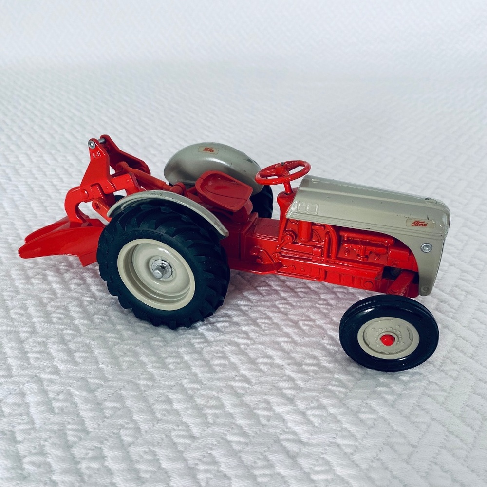 SOLD………..ERTL Ford Diecast Tractor with Plow